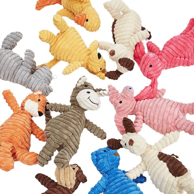 Assorted colorful dog toys on a white background