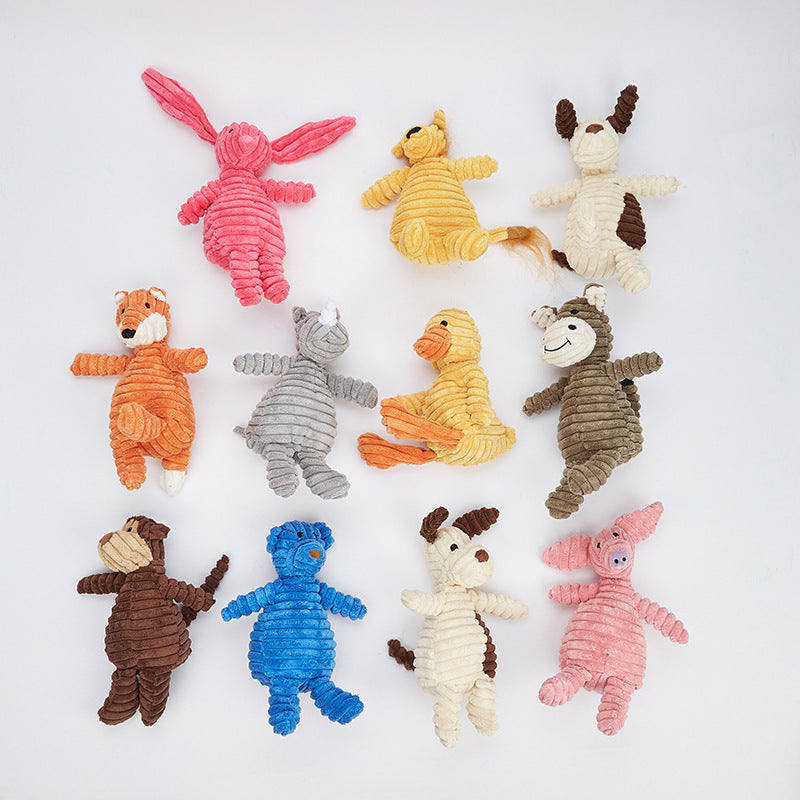 Assorted colorful dog toys on a white background
