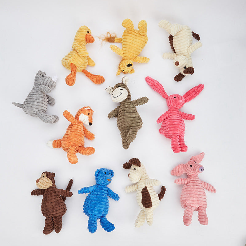 Assorted colorful dog toys on a white background